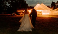 Bignor Park Weddings bride and groom Croquet Lawn reception in marquee at night